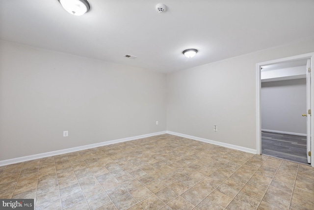 4111 Bayside Rd, Chesapeake Beach, MD 20732 - unfurnished bedroom with baseboards, a closet, and a walk in closet