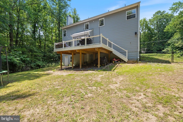 4111 Bayside Rd, Chesapeake Beach, MD 20732 - back of property with a trampoline, a deck, a chimney, and stairway