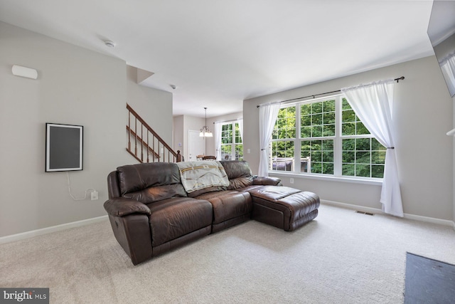 4111 Bayside Rd, Chesapeake Beach, MD 20732 - living area featuring carpet, stairway, a chandelier, and baseboards