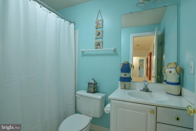 full bathroom featuring toilet and vanity