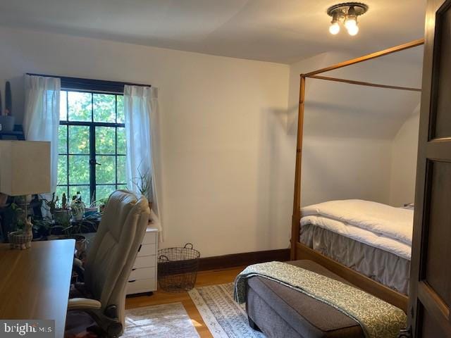 bedroom with wood finished floors