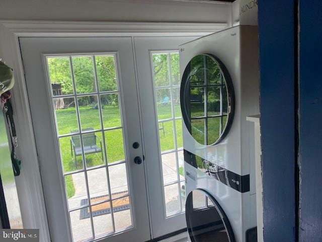 doorway with estacked washer and dryer and french doors