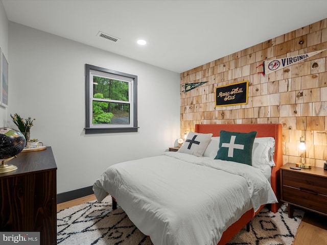 209 Hogan Dr, Basye, VA 22810 - bedroom with wood finished floors, an accent wall, recessed lighting, and baseboards