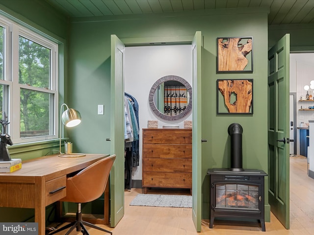 209 Hogan Dr, Basye, VA 22810 - office with plenty of natural light, wood finished floors, wooden ceiling, and a wood stove
