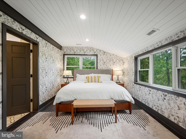 209 Hogan Dr, Basye, VA 22810 - bedroom featuring wallpapered walls, lofted ceiling, baseboards, and recessed lighting