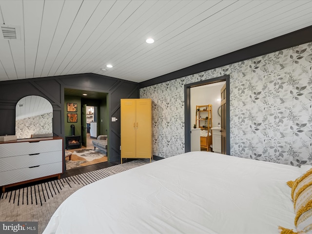 209 Hogan Dr, Basye, VA 22810 - bedroom featuring wallpapered walls, recessed lighting, and vaulted ceiling