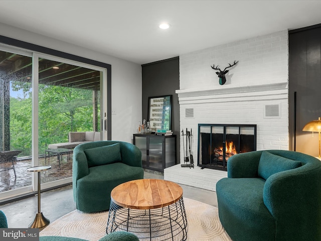 209 Hogan Dr, Basye, VA 22810 - living room with a brick fireplace, concrete flooring, and recessed lighting