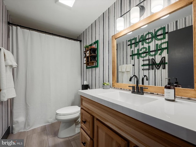 209 Hogan Dr, Basye, VA 22810 - full bath featuring wallpapered walls, toilet, and vanity