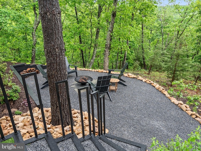 209 Hogan Dr, Basye, VA 22810 - surrounding community featuring a fire pit, a forest view, and a patio area