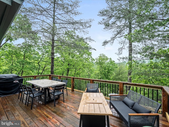 209 Hogan Dr, Basye, VA 22810 - wooden deck with outdoor dining space and an outdoor living space