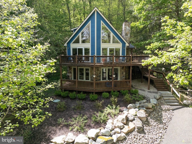 2119 Rock Lodge Rd, Mc Henry, MD 21541 - view of front facade featuring a deck, stone siding, stairway, and a wooded view