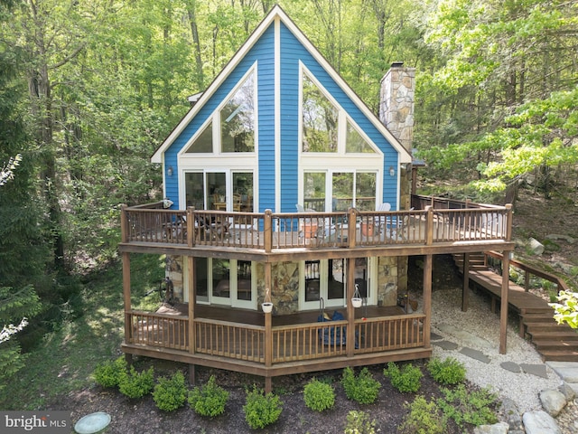 2119 Rock Lodge Rd, Mc Henry, MD 21541 - rear view of property with a wooden deck, a chimney, a forest view, and stone siding