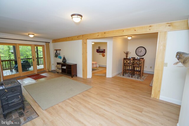 2119 Rock Lodge Rd, Mc Henry, MD 21541 - living room featuring a wood stove, wood finished floors, a baseboard radiator, and baseboards