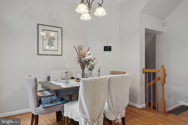 5533 Westcott Cir, Frederick, MD 21703 - dining space with a chandelier, baseboards, and wood finished floors