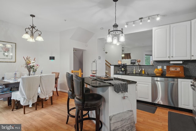 5533 Westcott Cir, Frederick, MD 21703 - kitchen with stainless steel dishwasher, a chandelier, and white cabinetry