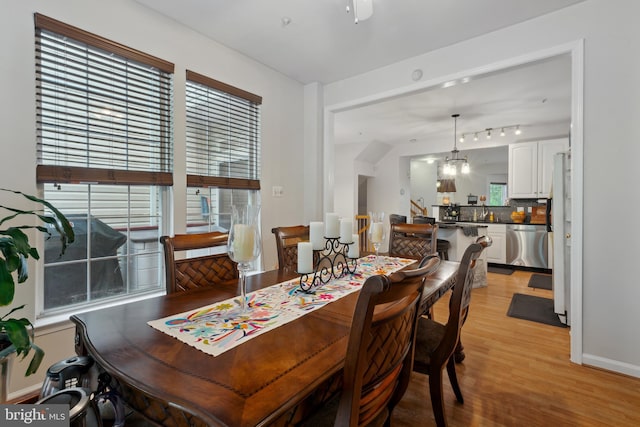 5533 Westcott Cir, Frederick, MD 21703 - dining space with light wood-style floors, baseboards, and a chandelier