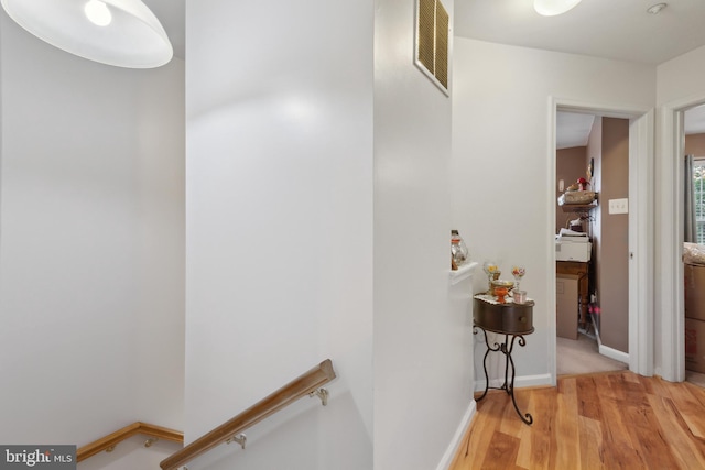 5533 Westcott Cir, Frederick, MD 21703 - hall with an upstairs landing, light wood-style flooring, and baseboards