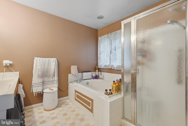 5533 Westcott Cir, Frederick, MD 21703 - bathroom featuring a shower stall, a bath, tile patterned floors, baseboards, and vanity