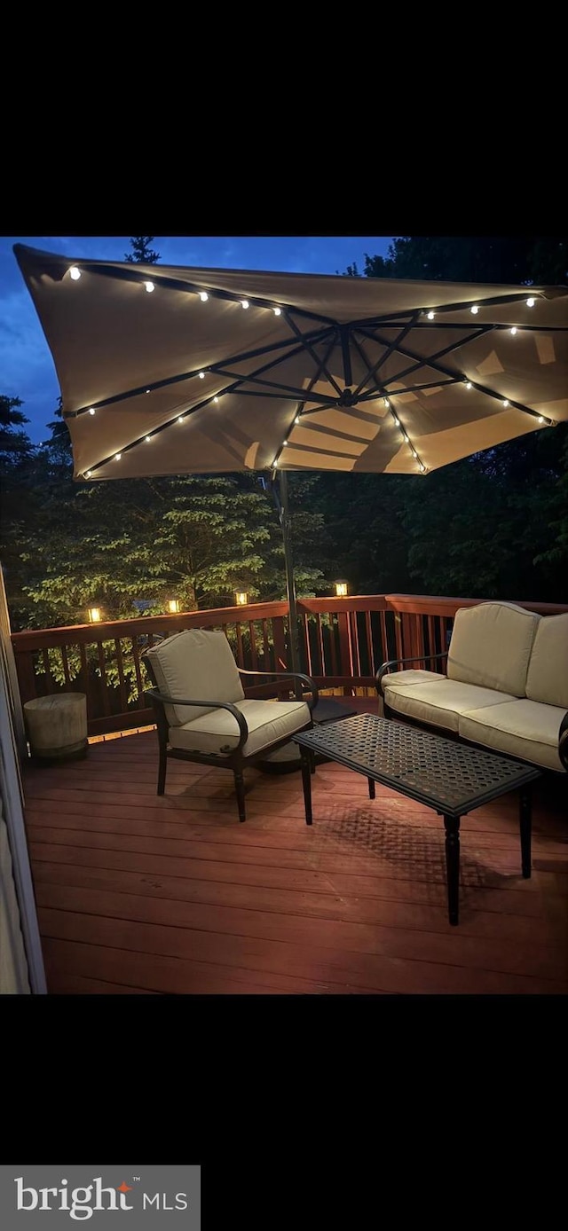 5533 Westcott Cir, Frederick, MD 21703 - deck at night featuring an outdoor living space