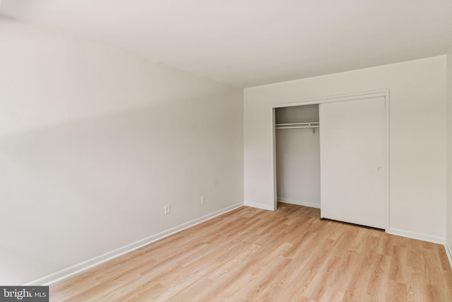 4931 Americana Dr Unit 4931B, Annandale, VA 22003 - unfurnished bedroom featuring wood finished floors, baseboards, and a closet