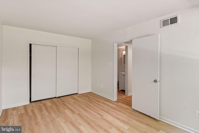 4931 Americana Dr Unit 4931B, Annandale, VA 22003 - unfurnished bedroom with light wood-style floors, baseboards, and a closet