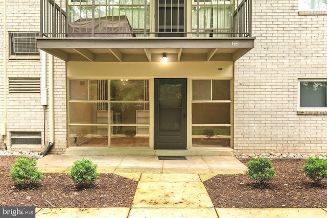 4931 Americana Dr Unit 4931B, Annandale, VA 22003 - property entrance featuring a balcony and brick siding