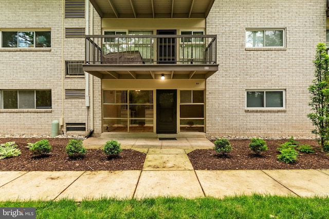 4931 Americana Dr Unit 4931B, Annandale, VA 22003 - doorway to property with a balcony and brick siding