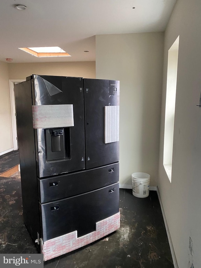 2710 Jefferson St, Baltimore, MD 21205 - detailed view of black fridge with ice dispenser and baseboards