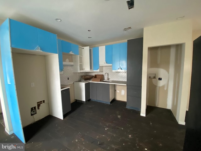 2710 Jefferson St, Baltimore, MD 21205 - kitchen featuring a sink, decorative backsplash, and dark wood-style floors