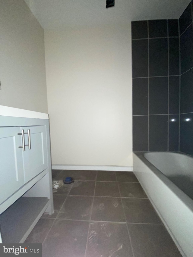 2710 Jefferson St, Baltimore, MD 21205 - full bath with vanity, tile patterned floors, baseboards, and shower / washtub combination