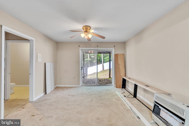 486 Round Up Rd, Lusby, MD 20657 - unfurnished living room with heating unit, carpet floors, ceiling fan, and baseboards