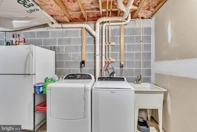486 Round Up Rd, Lusby, MD 20657 - laundry area featuring washer and clothes dryer and concrete block wall