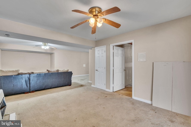 486 Round Up Rd, Lusby, MD 20657 - unfurnished living room with a ceiling fan, carpet floors, and baseboards
