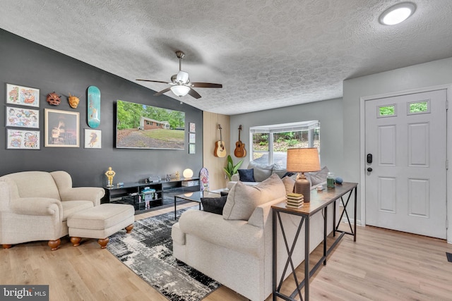 486 Round Up Rd, Lusby, MD 20657 - living room with wood finished floors, a textured ceiling, and ceiling fan