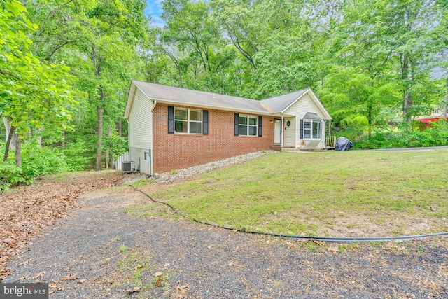 486 Round Up Rd, Lusby, MD 20657 - single story home with brick siding and a front yard