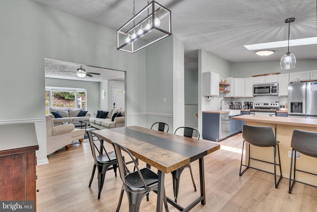486 Round Up Rd, Lusby, MD 20657 - dining room with light wood-style floors and a ceiling fan