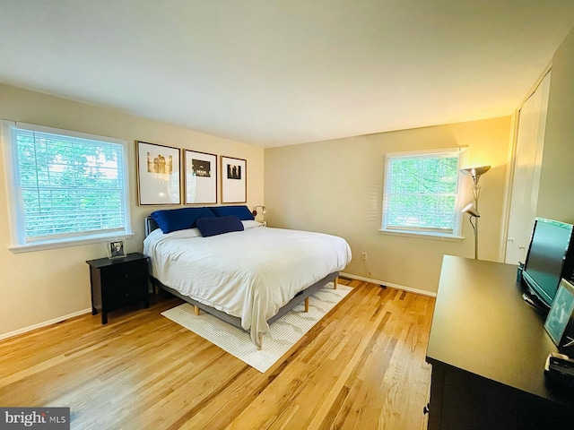 12112 Bayswater Rd, Gaithersburg, MD 20878 - bedroom featuring light wood-style flooring and baseboards