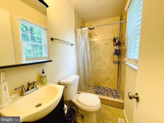 12112 Bayswater Rd, Gaithersburg, MD 20878 - bathroom with a tile shower, tile patterned flooring, toilet, and vanity
