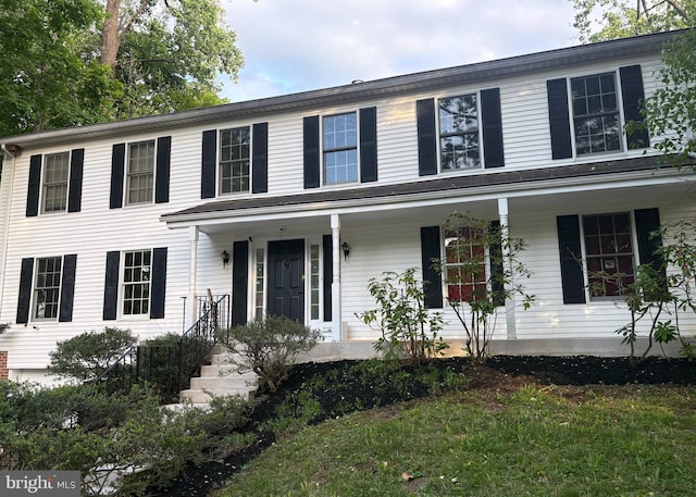 colonial-style house with covered porch