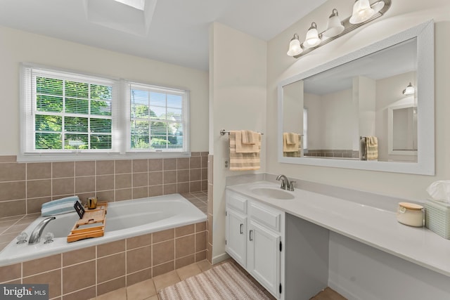 full bath with vanity, a bath, and tile patterned flooring