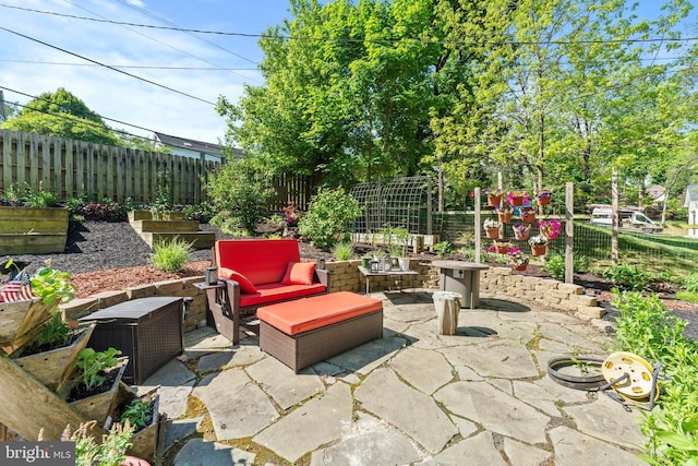 view of patio with a fenced backyard and an outdoor hangout area