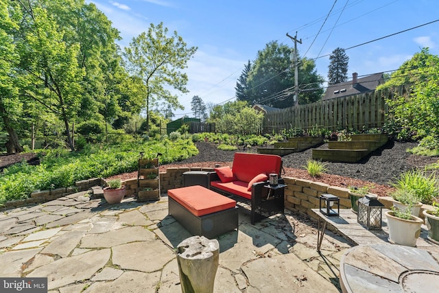 view of patio with a fenced backyard and an outdoor hangout area