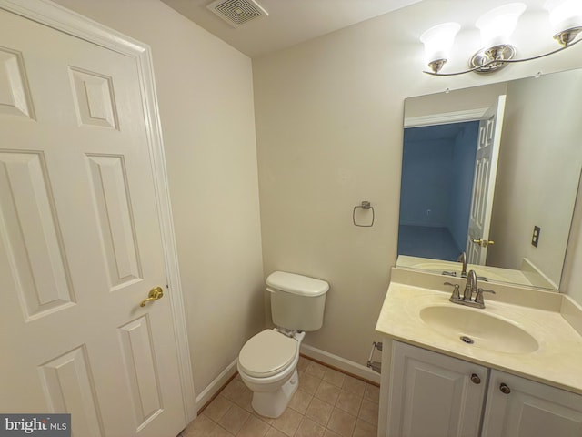 half bath with toilet, baseboards, visible vents, tile patterned floors, and vanity