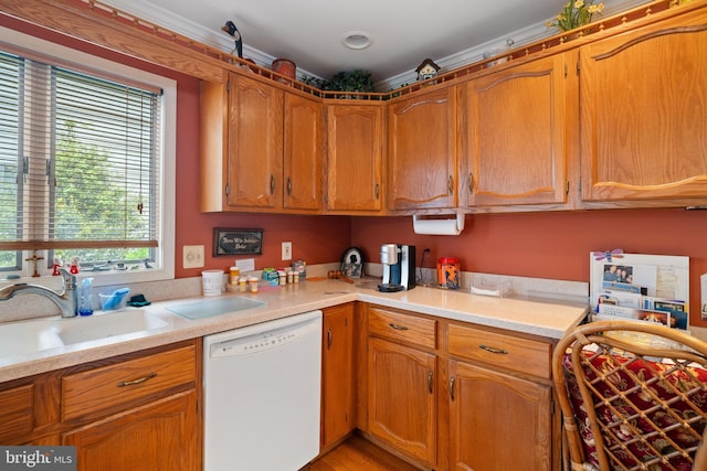 87 Ash Rd, Manahawkin, NJ 08050 - kitchen featuring dishwasher, a sink, light countertops, and brown cabinets