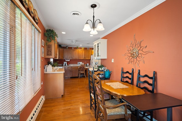 87 Ash Rd, Manahawkin, NJ 08050 - dining area featuring a chandelier, a baseboard heating unit, ornamental molding, light wood finished floors, and recessed lighting