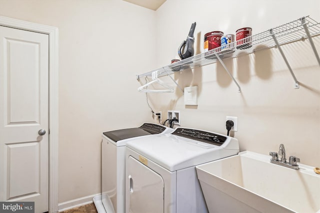 10809 Glowing Hearth Way, Monrovia, MD 21770 - laundry room featuring separate washer and dryer and baseboards
