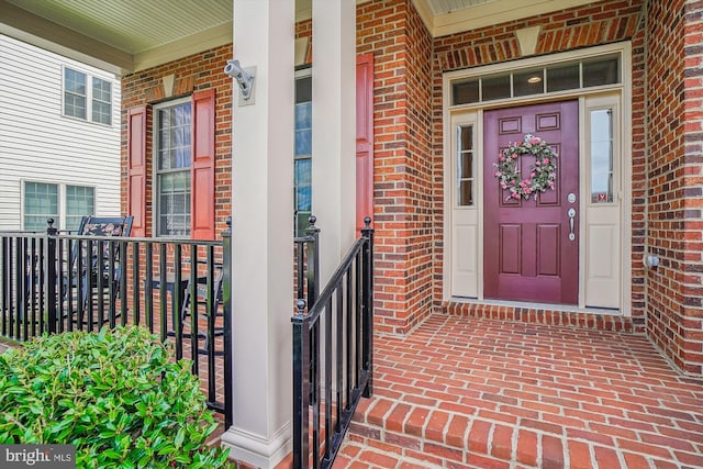 10809 Glowing Hearth Way, Monrovia, MD 21770 - doorway to property with a porch and brick siding