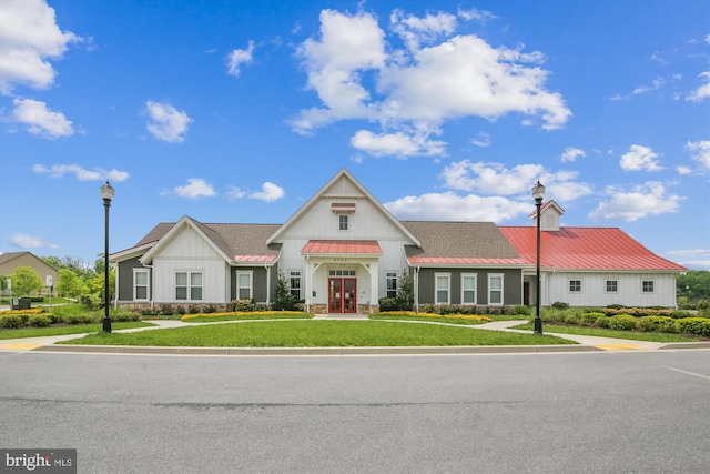 10809 Glowing Hearth Way, Monrovia, MD 21770 - view of front of home with french doors, board and batten siding, a front lawn, metal roof, and a standing seam roof