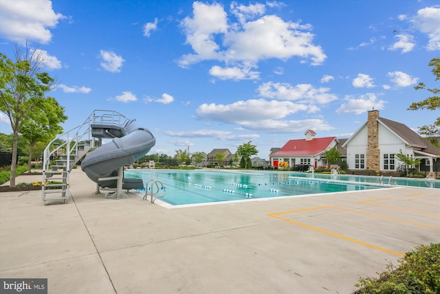 10809 Glowing Hearth Way, Monrovia, MD 21770 - community pool featuring a water slide, a patio, and stairway
