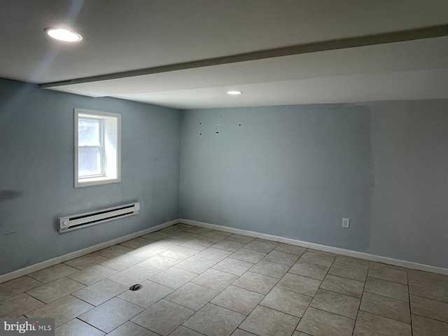 empty room with light tile patterned floors, a baseboard radiator, recessed lighting, and baseboards